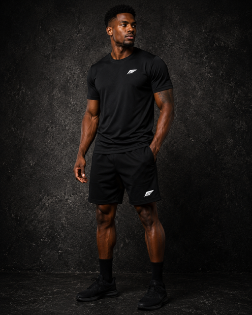 Earned 1 Performance Shorts in black, worn with the black Earned 1 Performance Tee