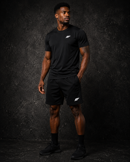 Earned 1 Performance Shorts in black, worn with the black Earned 1 Performance Tee